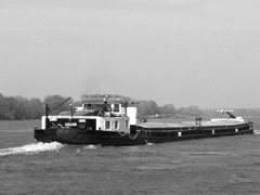 A Romanian Barge heading up stream